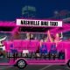 A pink furry party bike in Nashville Tennessee. This contraption has seats on either side of a 20ft long vehicle where patrons pedal the bar to power it. The rear seating area can hold a bench or up to two wheel chairs. Some of the pedal seats on the side of the pedal bar have been replaced with airplane row seating to give trunk support to guest with other types of disabilities.