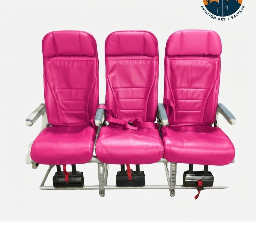 Southwest Airplane seats repurposed for ADA A refurbished southwest airline row of seating. These seats have pink upholstery.